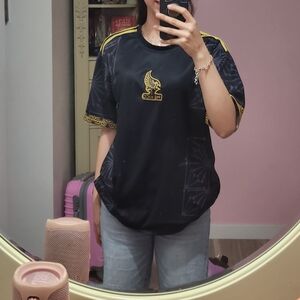 Nike Women's Black and Gold Jersey Top